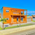 Maison modulaire T4 en bois 193 m² – 4 chambres, 3 salles de bain, garage et terrasse – Style moderne